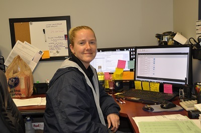 Angela Bennett at desk